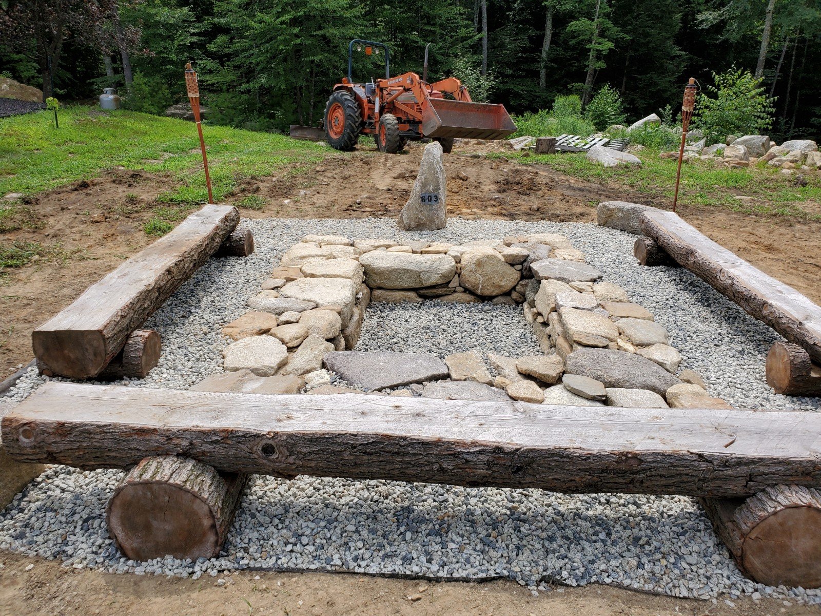 Natural fireplace with log benching