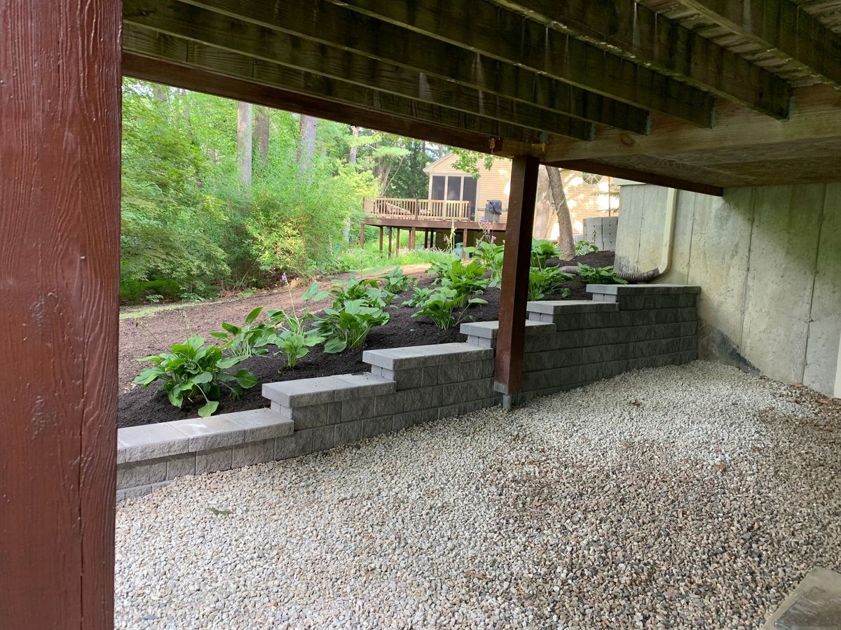 Retaining wall with garden under porch